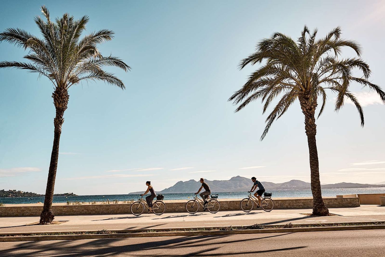 Cycling along the promenade in Port de Pollença
